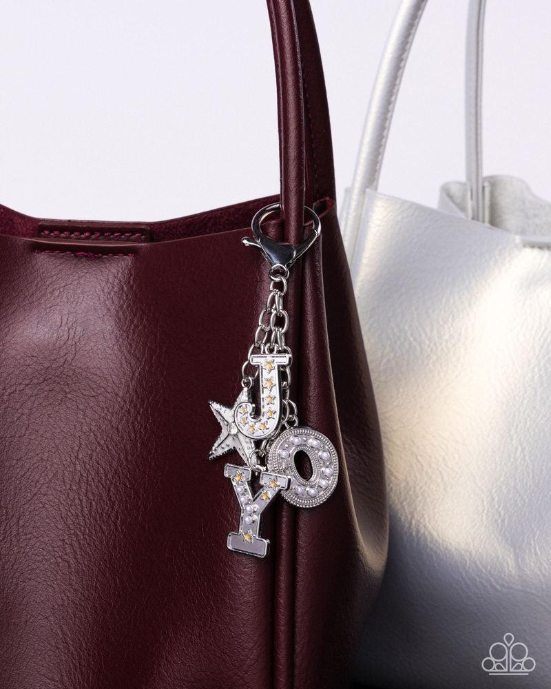 Make a Joyful Noise Multi Silver & White Bag Charm - Paparazzi Accessories