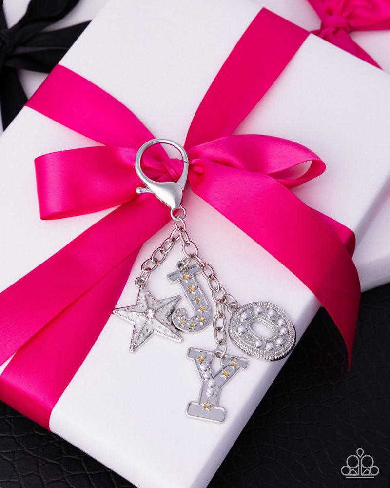 Make a Joyful Noise Multi Silver & White Bag Charm - Paparazzi Accessories