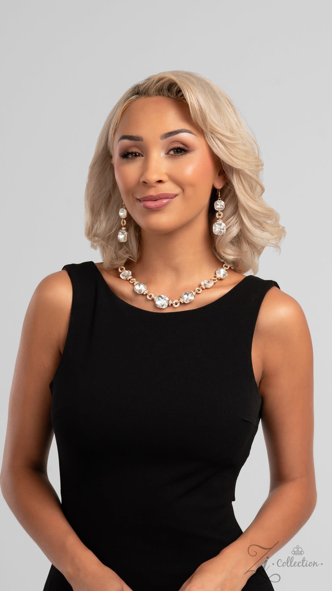 The Crystal 2024 Zi Signature Collection Necklace - Paparazzi Accessories stylized on model wearing black - CarasShop.com - Paparazzi Jewelry by Cara Jewels