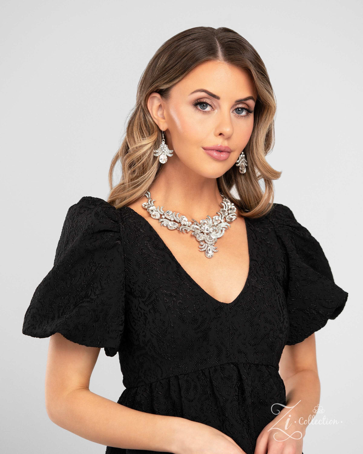 The Gesphania 2024 Zi Signature Collection Necklace - Paparazzi Accessories stylized on model wearing black - CarasShop.com - Paparazzi Jewelry by Cara Jewels