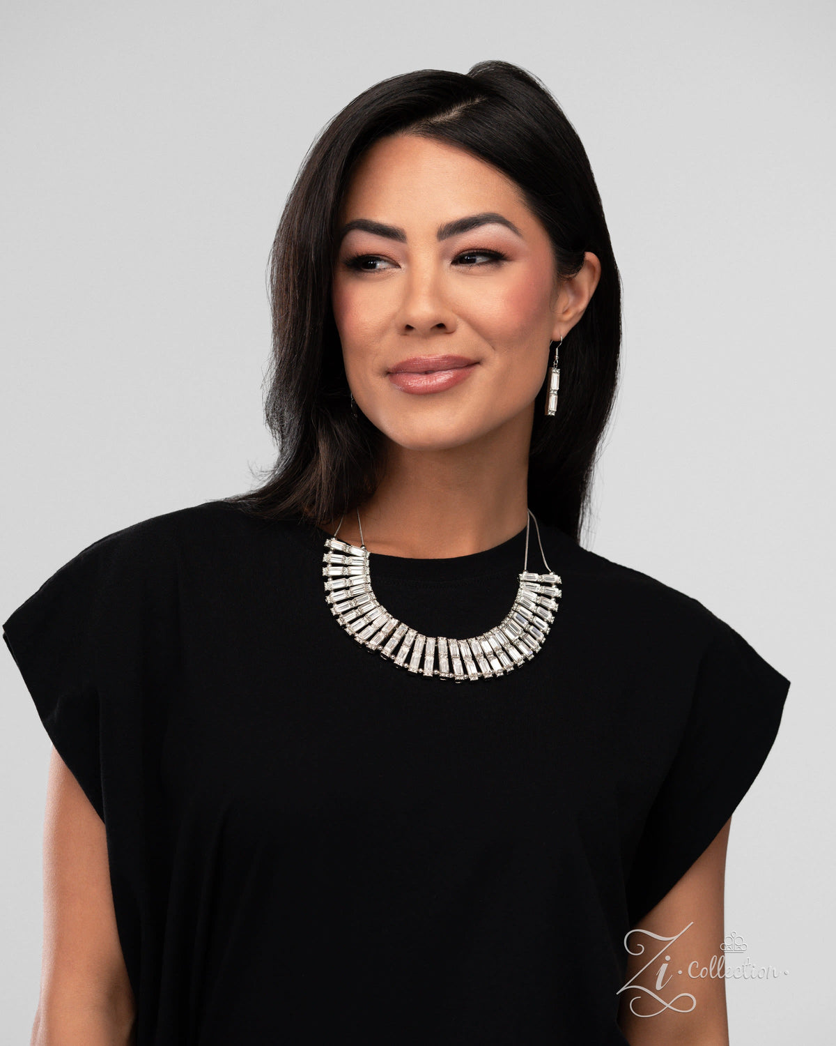 The Leslie 2024 Zi Signature Collection Necklace - Paparazzi Accessories stylized on model wearing black - CarasShop.com - Paparazzi Jewelry by Cara Jewels