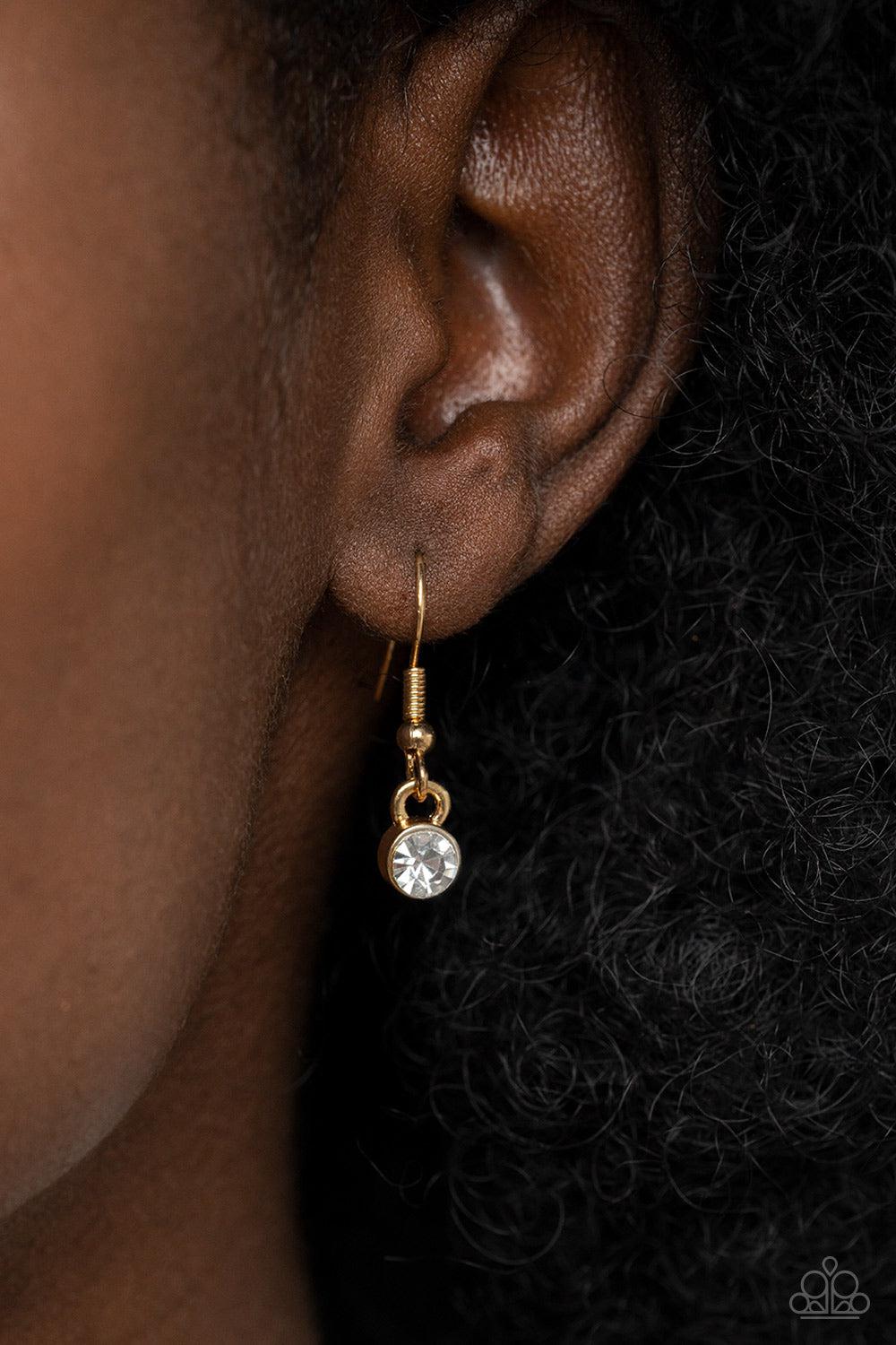 The Real Deal Gold and White Rhinestone Necklace - Paparazzi Accessories - free matching earrings -CarasShop.com - Paparazzi Jewelry by Cara Jewels