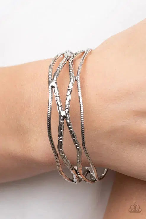 A Narrow ESCAPADE Silver Bracelet - Paparazzi Accessories- on model - CarasShop.com - Paparazzi Jewelry by Cara Jewels
