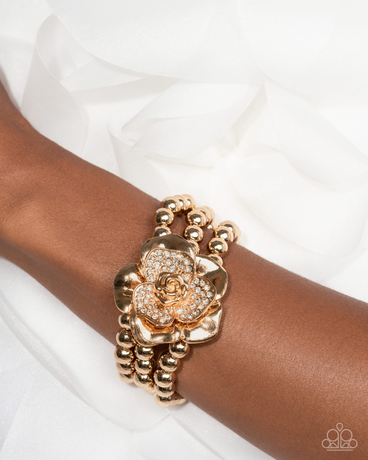 Blooming Background Gold & White Rhinestone Flower Bracelet - Paparazzi Accessories-on model - CarasShop.com - Paparazzi Jewelry by Cara Jewels