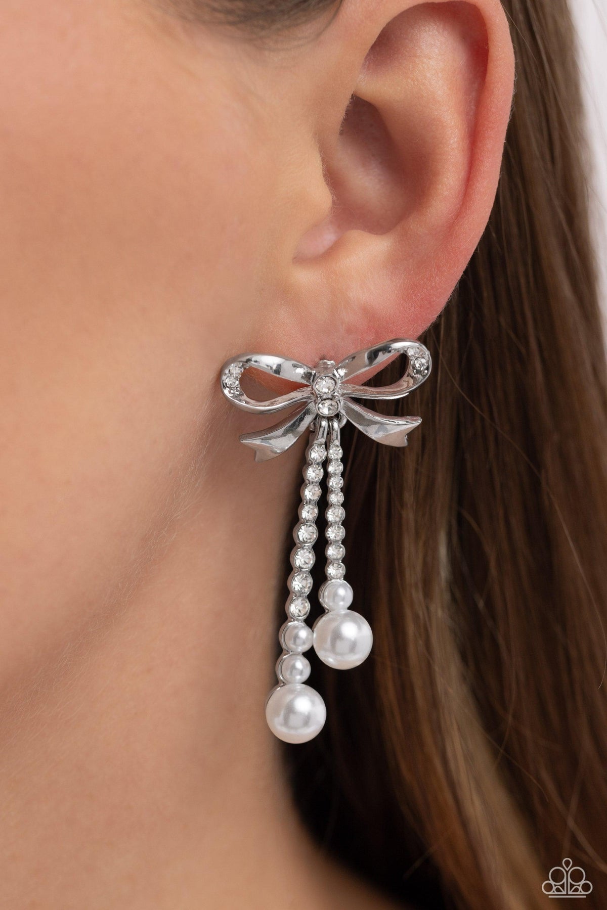 Bodacious Bow White Rhinestone & Pearl Bow Earrings - Paparazzi Accessories- on model - CarasShop.com - Paparazzi Jewelry by Cara Jewels