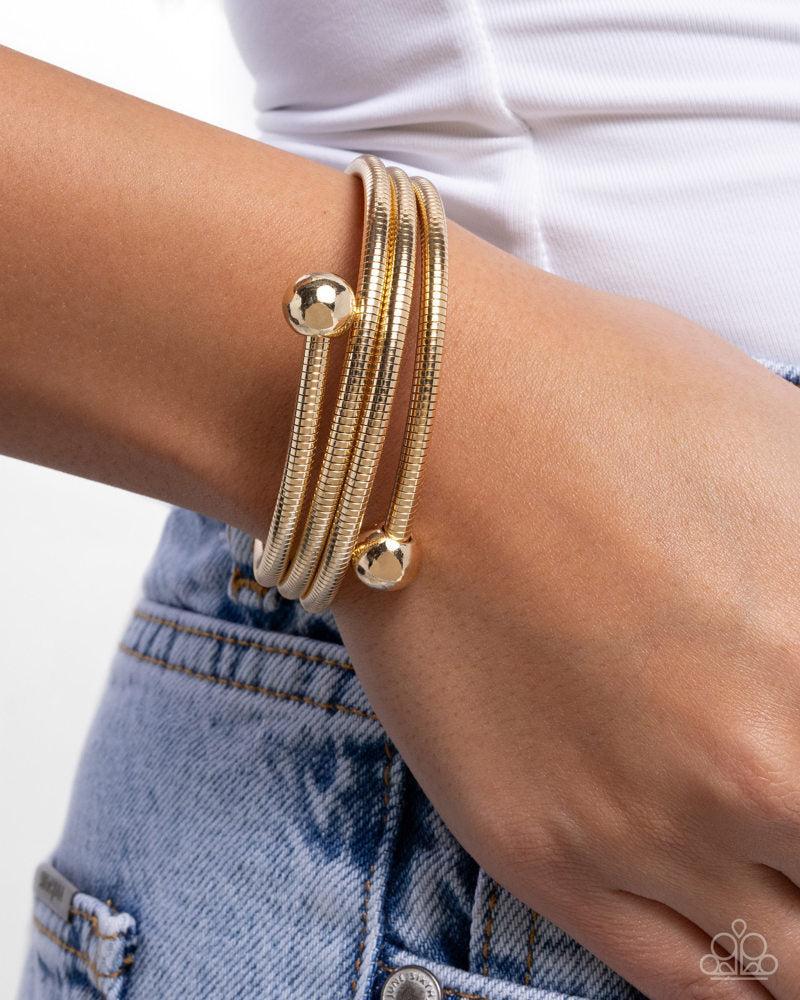 Calmly Coiled Gold Bracelet - Paparazzi Accessories-on model - CarasShop.com - Paparazzi Jewelry by Cara Jewels