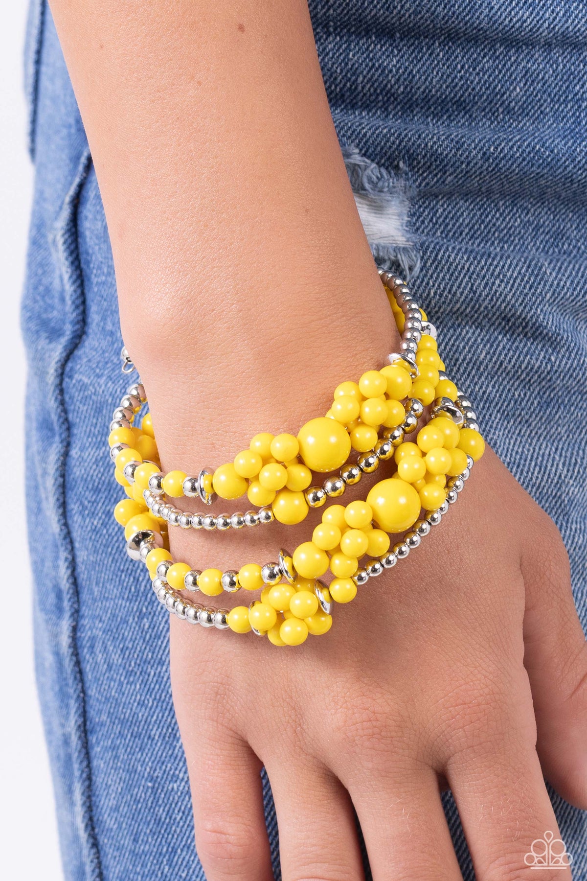 Compelling Clouds Yellow Coil Bracelet - Paparazzi Accessories- on model - CarasShop.com - Paparazzi Jewelry by Cara Jewels