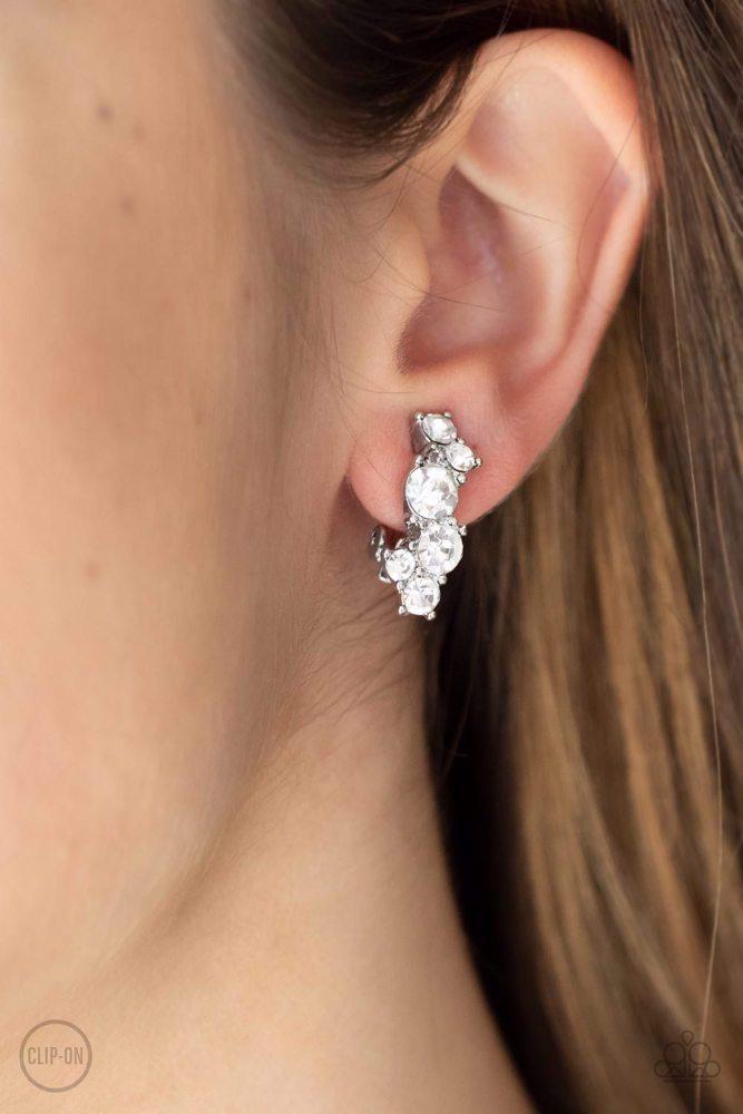 Cosmic Celebration White Clip-on Earrings - Paparazzi Accessories- lightbox - CarasShop.com - Paparazzi Jewelry by Cara Jewels