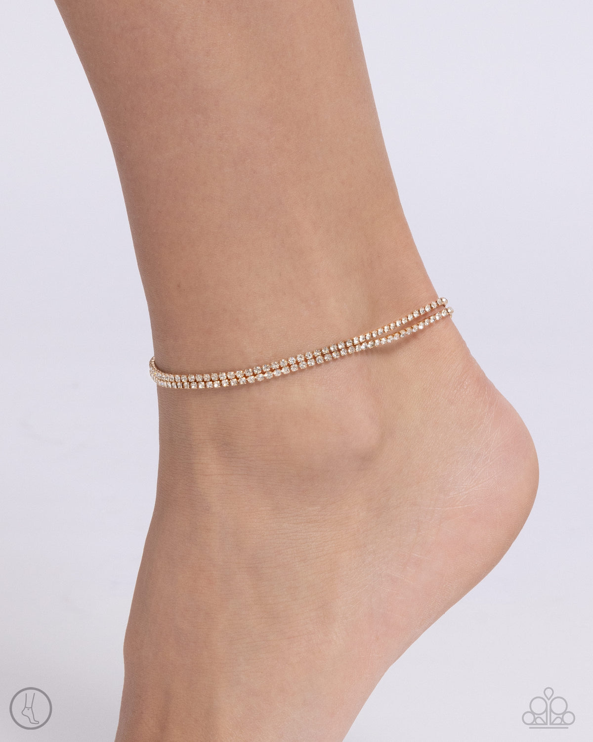 Dainty Declaration Gold & White Rhinestone Anklet - Paparazzi Accessories- on model - CarasShop.com - Paparazzi Jewelry by Cara Jewels
