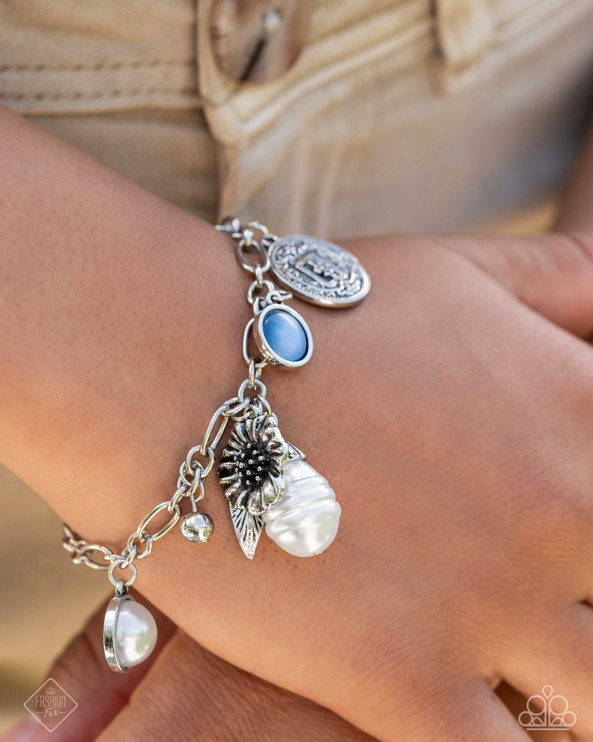 Enduring Energy Blue Charm Bracelet - Paparazzi Accessories- on model - CarasShop.com - Paparazzi Jewelry by Cara Jewels