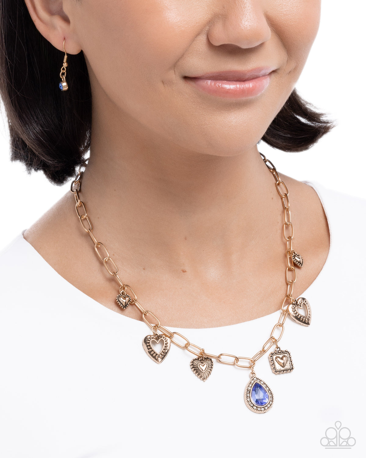 Flirtatious Framing Blue Gem & Antique Gold Heart Necklace - Paparazzi Accessories-on model - CarasShop.com - Paparazzi Jewelry by Cara Jewels