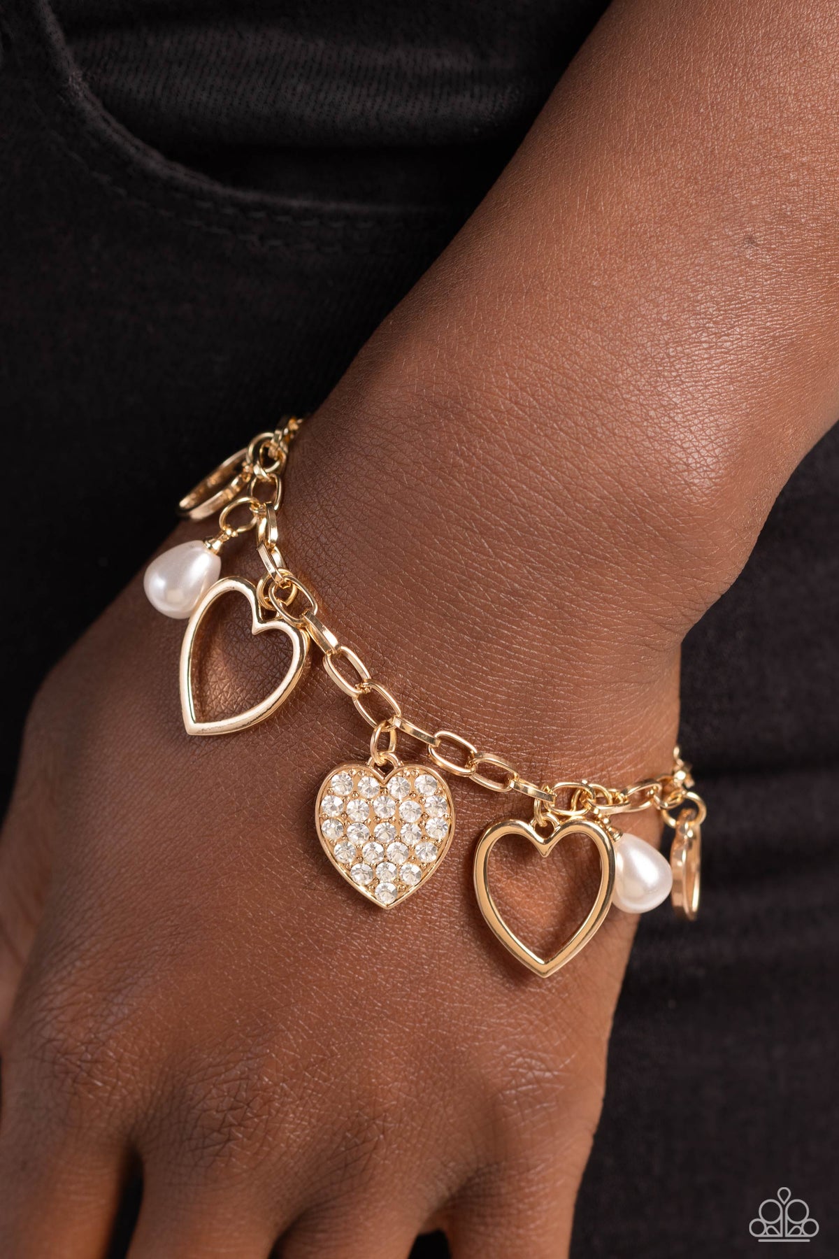 GLOW Your Heart Gold Heart Charm Bracelet - Paparazzi Accessories- on model - CarasShop.com - Paparazzi Jewelry by Cara Jewels