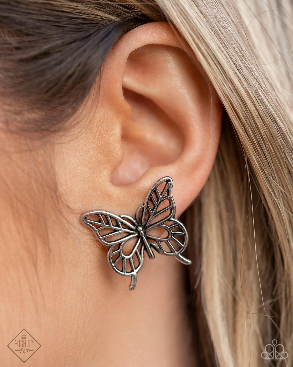 High and FLIGHTY Silver Butterfly Earrings - Paparazzi Accessories- on model - CarasShop.com - Paparazzi Jewelry by Cara Jewels