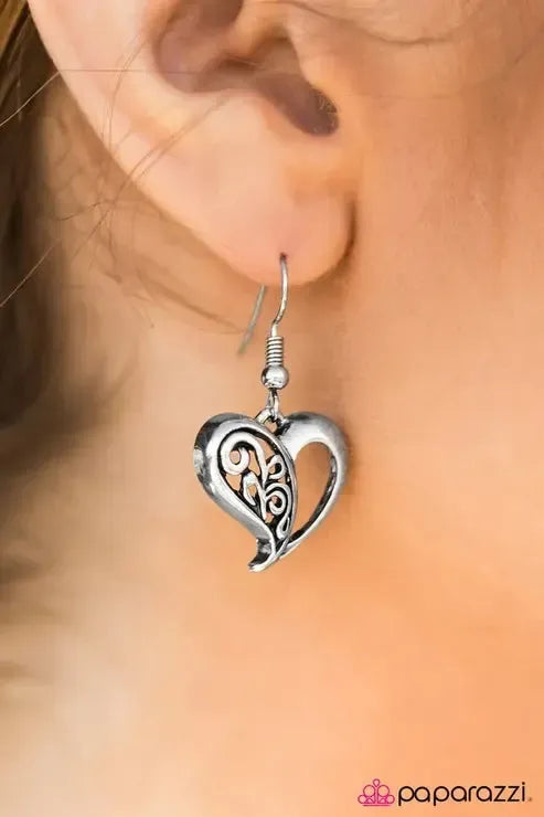 How Heartwarming Silver Heart Earrings - Paparazzi Accessories- on model - CarasShop.com - Paparazzi Jewelry by Cara Jewels