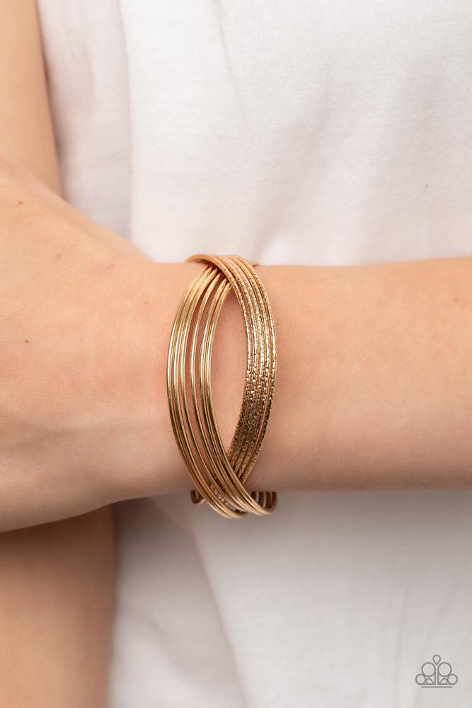 Industrialized Shimmer Gold Bracelet - Paparazzi Accessories- on model - CarasShop.com - Paparazzi Jewelry by Cara Jewels