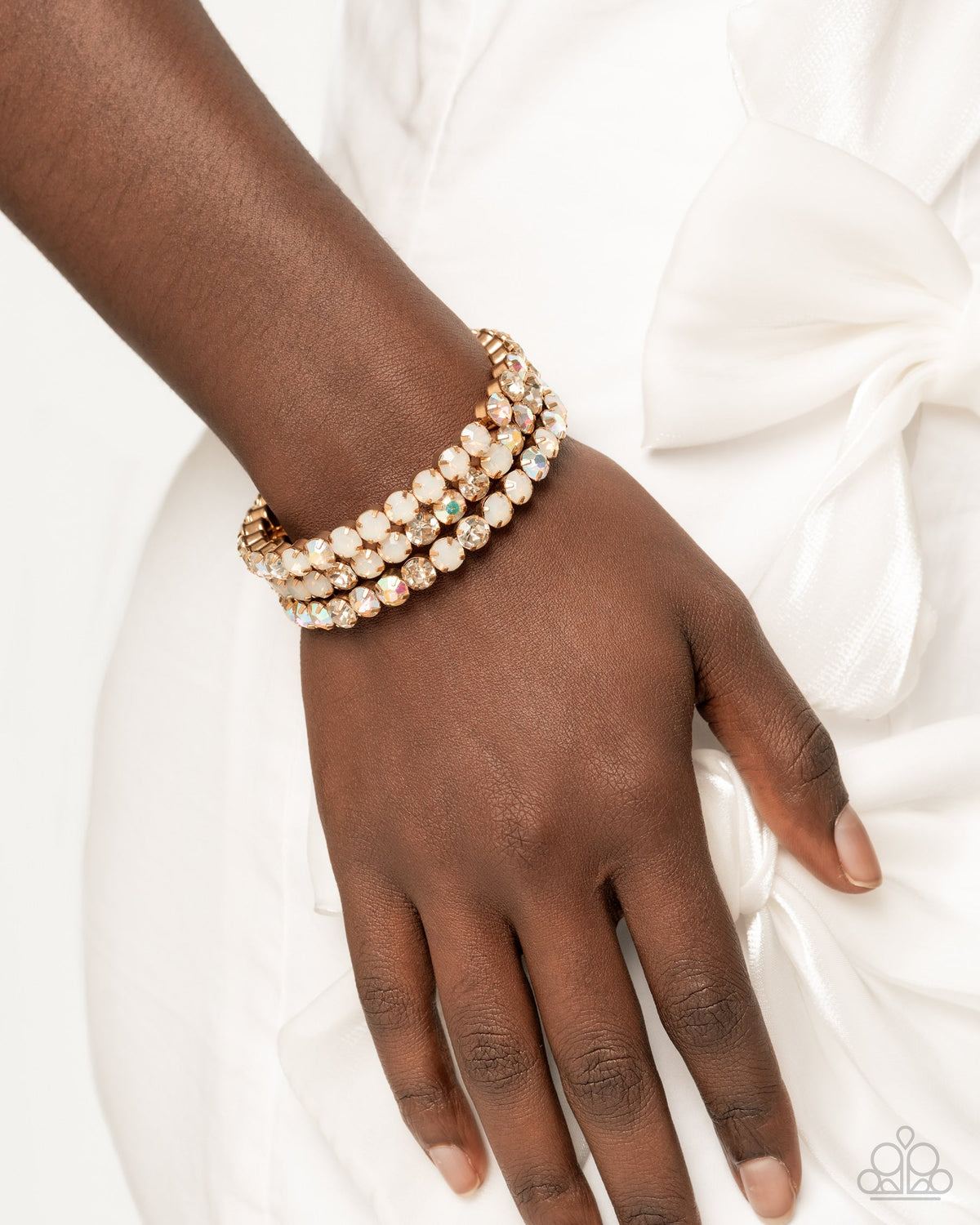 Iridescent Incantation Multi Rhinestone & Gold Coil Bracelet- on model - CarasShop.com - Paparazzi Jewelry by Cara Jewels