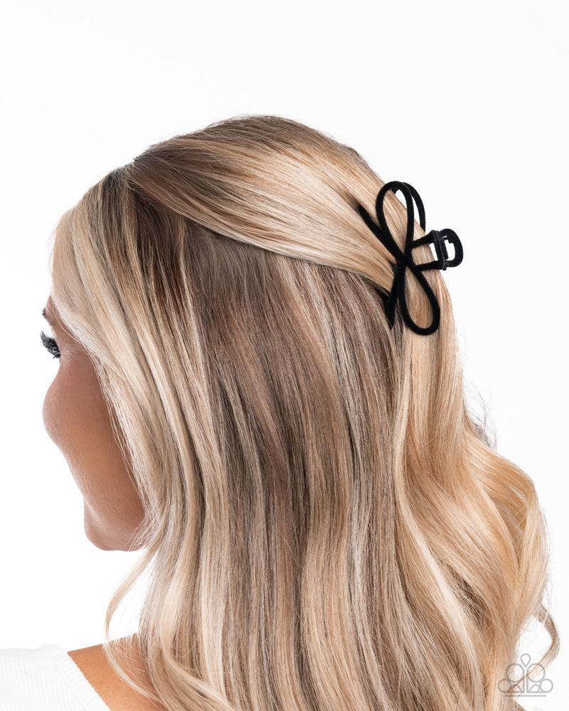 Merry BOW Round Black Hair Clip - Paparazzi Accessories- on model - CarasShop.com - Paparazzi Jewelry by Cara Jewels