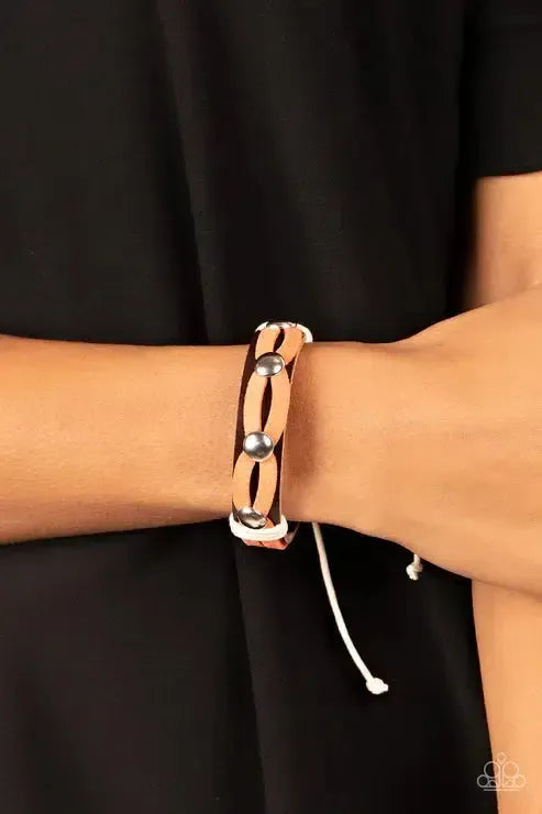 Ready To Ride Orange Bracelet - Paparazzi Accessories- on model - CarasShop.com - Paparazzi Jewelry by Cara Jewels