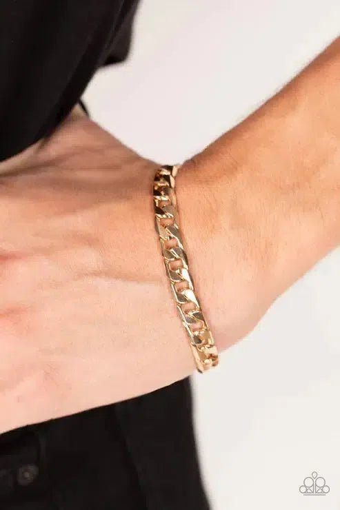 Rockstar Road Men's Gold Bracelet - Paparazzi Accessories-on model - CarasShop.com - Paparazzi Jewelry by Cara Jewels