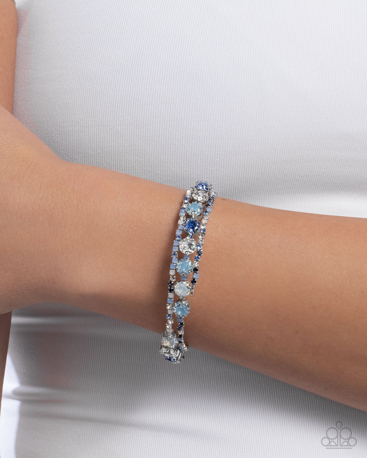 Shimmery Sample Blue Rhinestone Coil Bracelet - Paparazzi Accessories-on model - CarasShop.com - Paparazzi Jewelry by Cara Jewels