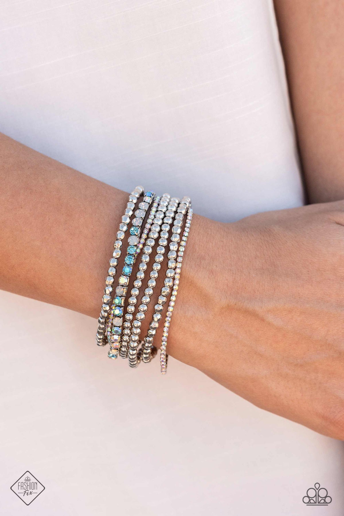 Stellar Sequence Blue & Iridescent Rhinestone Bracelet - Paparazzi Accessories- on model - CarasShop.com - Paparazzi Jewelry by Cara Jewels