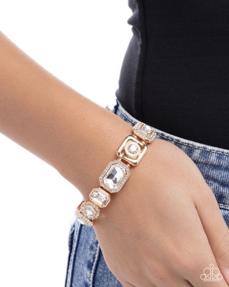 Striking Shimmer Gold & White Rhinestone Bracelet - Paparazzi Accessories-on model - CarasShop.com - Paparazzi Jewelry by Cara Jewels