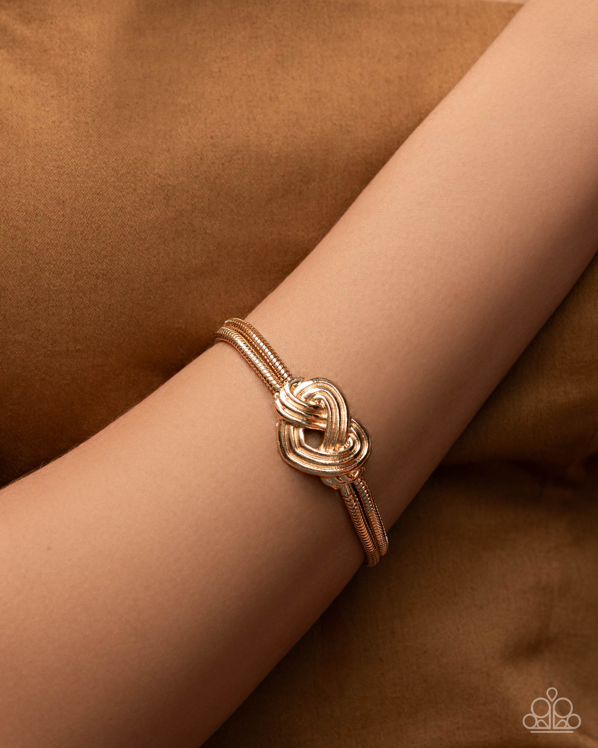 Woven Warrior Gold Bracelet - Paparazzi Accessories-on model - CarasShop.com - Paparazzi Jewelry by Cara Jewels