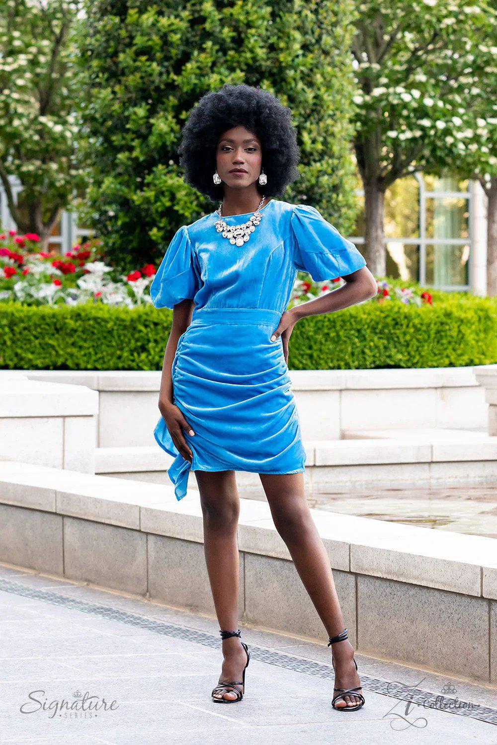 The Tasha 2022 Zi Signature Collection Necklace - Paparazzi Accessories stylized on model in casual dress - CarasShop.com - Paparazzi Jewelry by Cara Jewels