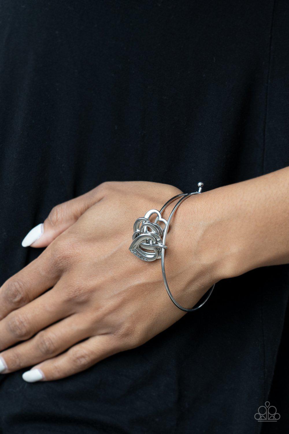 A Charmed Society Silver Inspirational Heart Bracelet - Paparazzi Accessories- on model - CarasShop.com - Paparazzi Jewelry by Cara Jewels