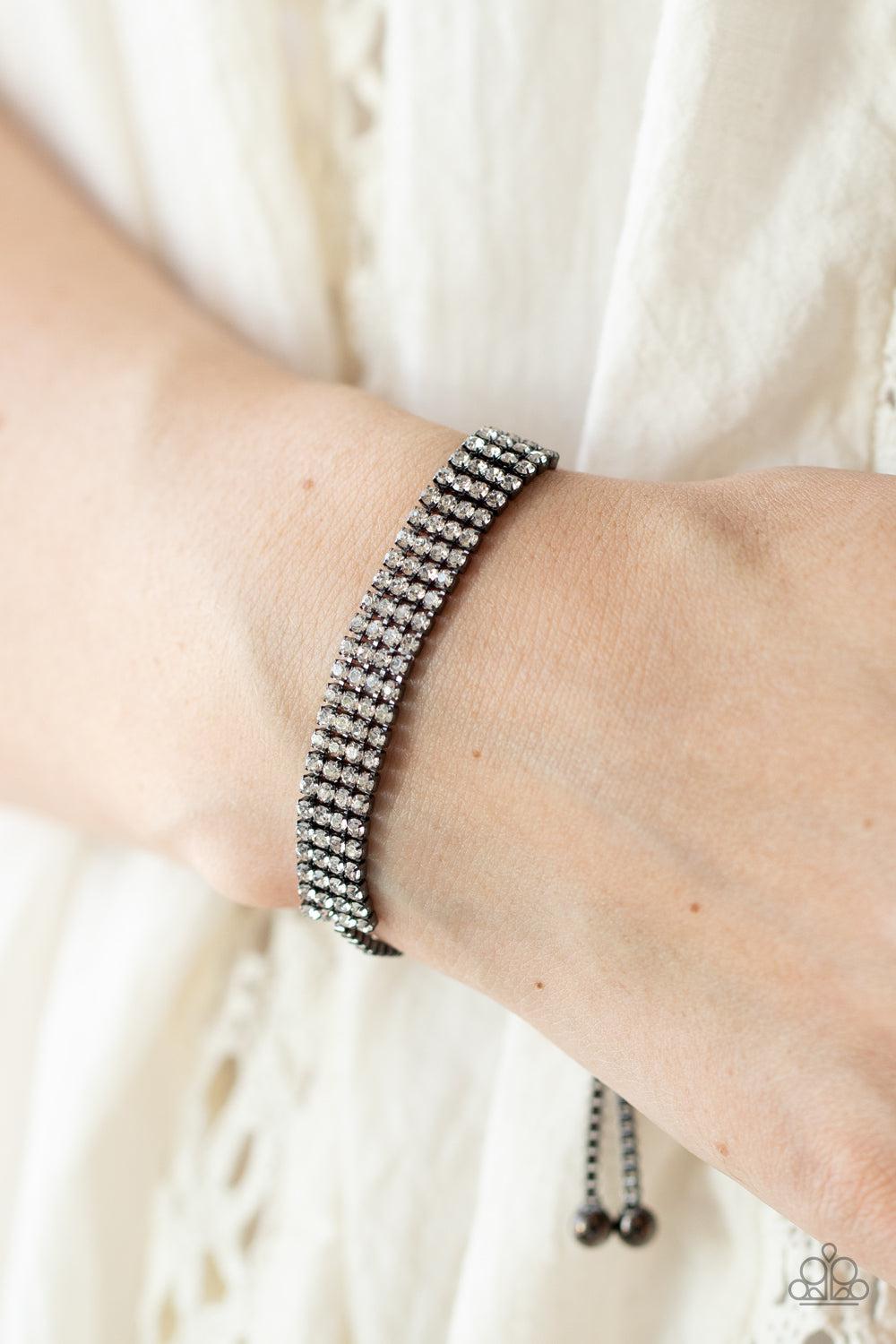 A DIAMOND a Dozen Gunmetal Black & White Rhinestone Slide Bracelet - Paparazzi Accessories- on model - CarasShop.com - Paparazzi Jewelry by Cara Jewels