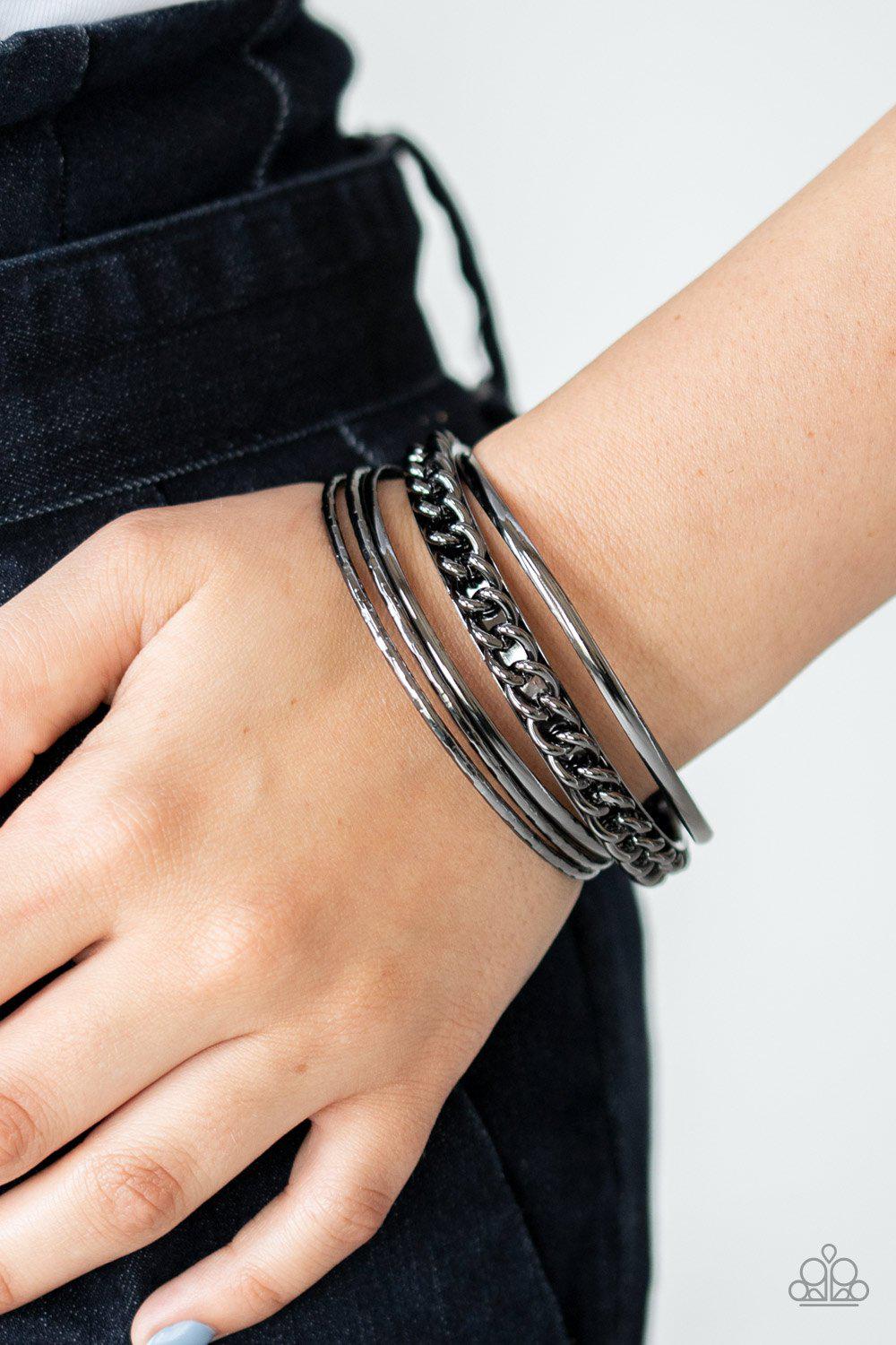 A Piece of The Action Gunmetal Black Bangle Bracelet Set - Paparazzi Accessories- on model - CarasShop.com - Paparazzi Jewelry by Cara Jewels
