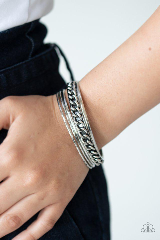 A Piece of the Action Silver Bangle Bracelet - Paparazzi Accessories- on model - CarasShop.com - Paparazzi Jewelry by Cara Jewels