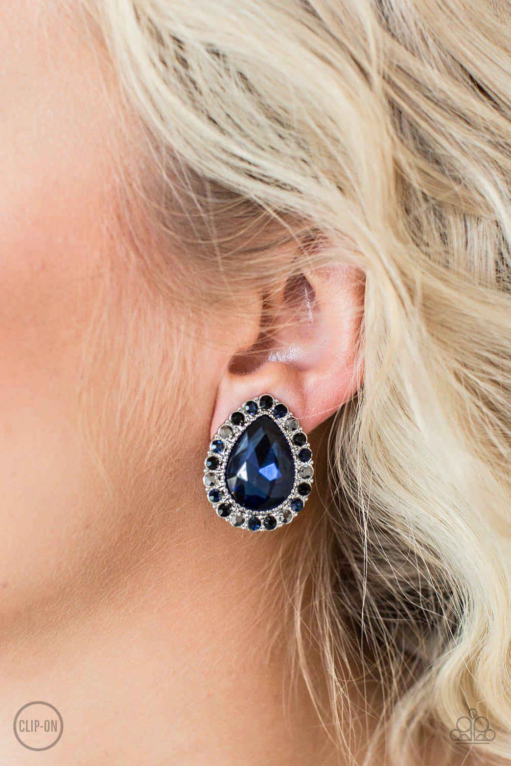 All HAUTE and Bothered Multi Blue and Hematite Rhinestone Clip-on Earrings - Paparazzi Accessories- on model - CarasShop.com - Paparazzi Jewelry by Cara Jewels