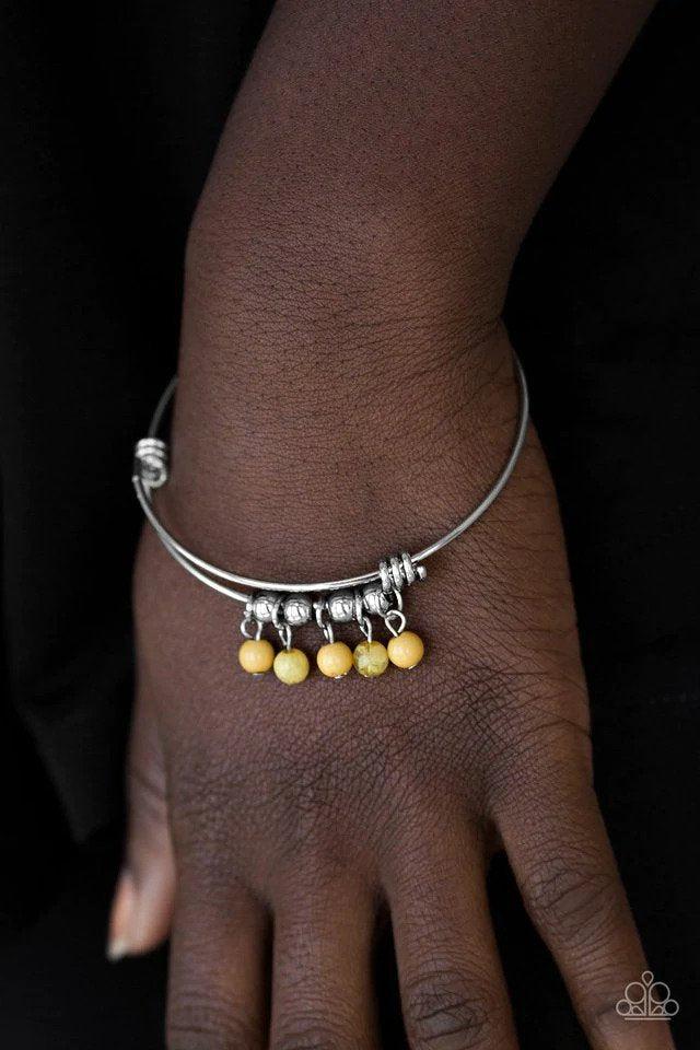 All Roads Lead To ROAM Yellow Bracelet - Paparazzi Accessories- on model - CarasShop.com - Paparazzi Jewelry by Cara Jewels