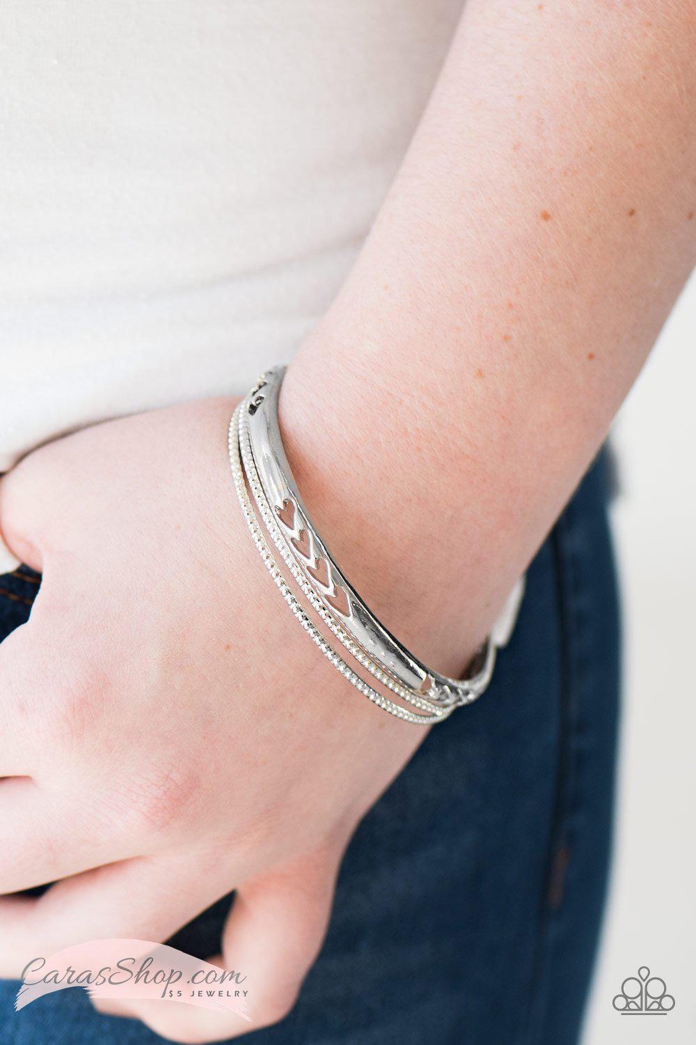 Amazon Warrior Silver Bangle Bracelet Set - Paparazzi Accessories- on model - CarasShop.com - Paparazzi Jewelry by Cara Jewels