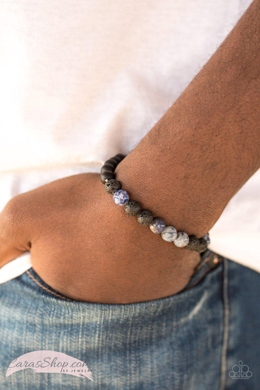 Ambition Blue Lava Rock Stretch Bracelet - Paparazzi Accessories- on model - CarasShop.com - Paparazzi Jewelry by Cara Jewels