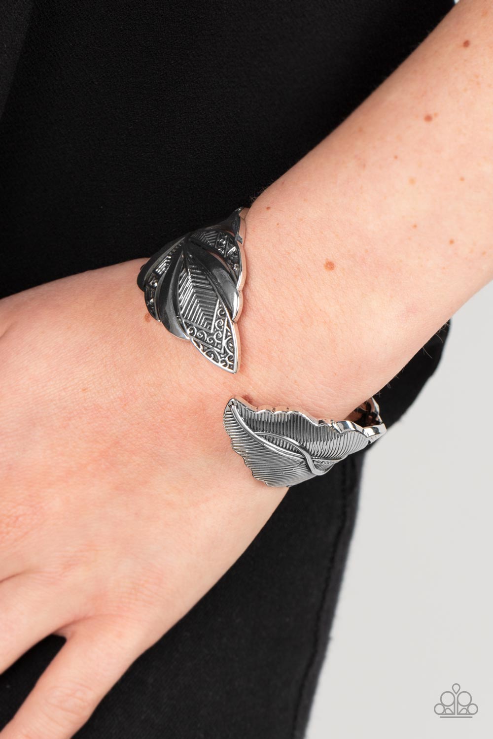 American Art Silver Feather Bracelet - Paparazzi Accessories- on model - CarasShop.com - Paparazzi Jewelry by Cara Jewels