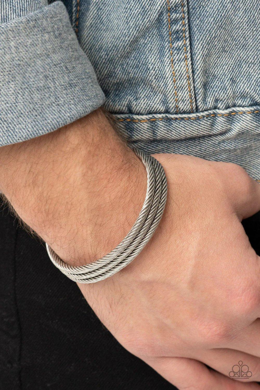 Armored Cable Men's Silver Cuff Bracelet - Paparazzi Accessories- on model - CarasShop.com - Paparazzi Jewelry by Cara Jewels