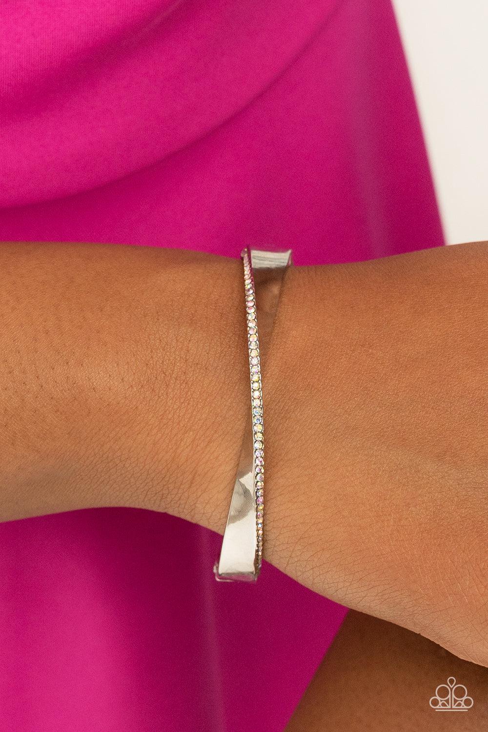 Artistically Adorned Multi Iridescent Rhinestone Hinged Bracelet - Paparazzi Accessories- on model - CarasShop.com - Paparazzi Jewelry by Cara Jewels