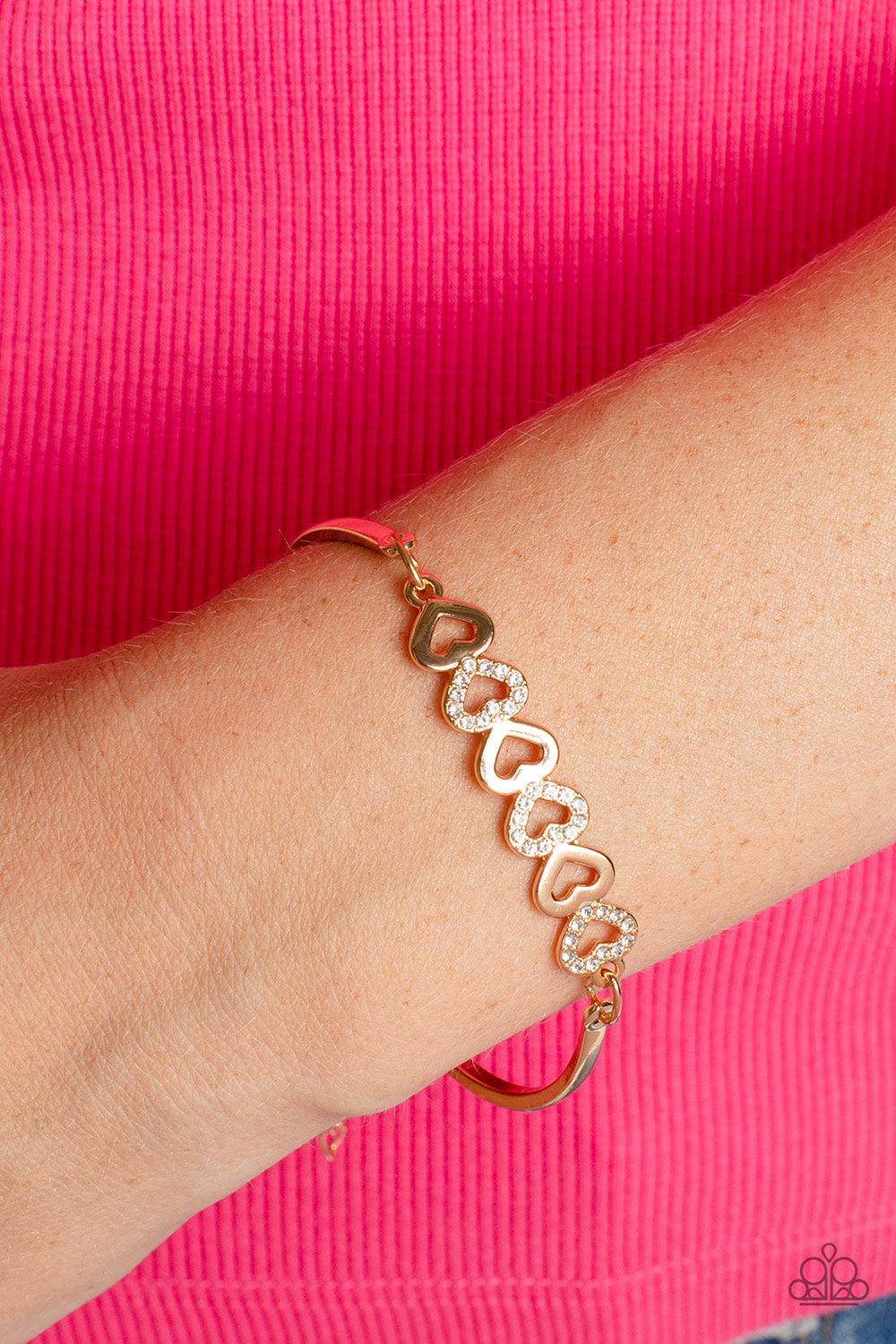 Attentive Admirer Gold Heart Bracelet - Paparazzi Accessories- lightbox - CarasShop.com - Paparazzi Jewelry by Cara Jewels