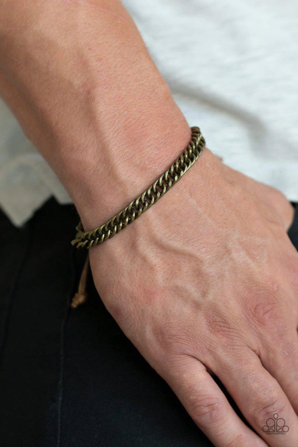 AWOL Men's Brass Urban Slide Bracelet - Paparazzi Accessories- on model - CarasShop.com - Paparazzi Jewelry by Cara Jewels