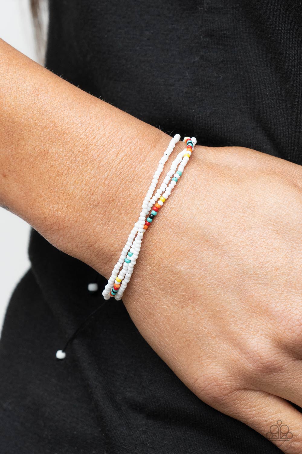 Basecamp Boyfriend White Seed Bead Sliding Knot Bracelet - Paparazzi Accessories- on model - CarasShop.com - Paparazzi Jewelry by Cara Jewels