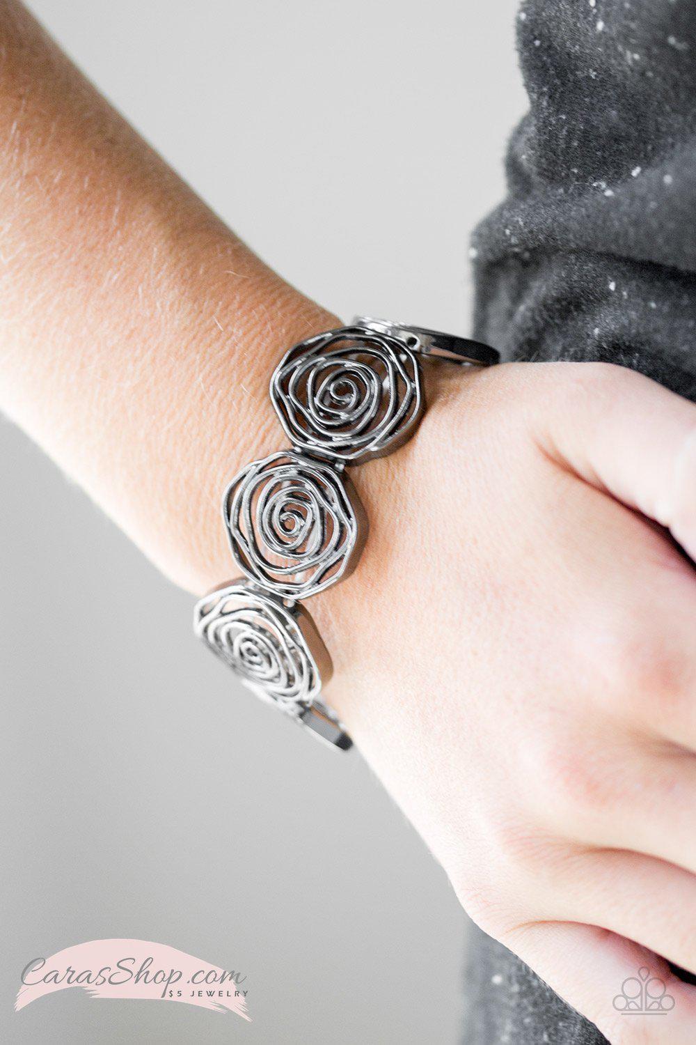 Beat Around The ROSEBUSH - Black Flower Stretch Bracelet - Paparazzi Accessories- on model - CarasShop.com - Paparazzi Jewelry by Cara Jewels