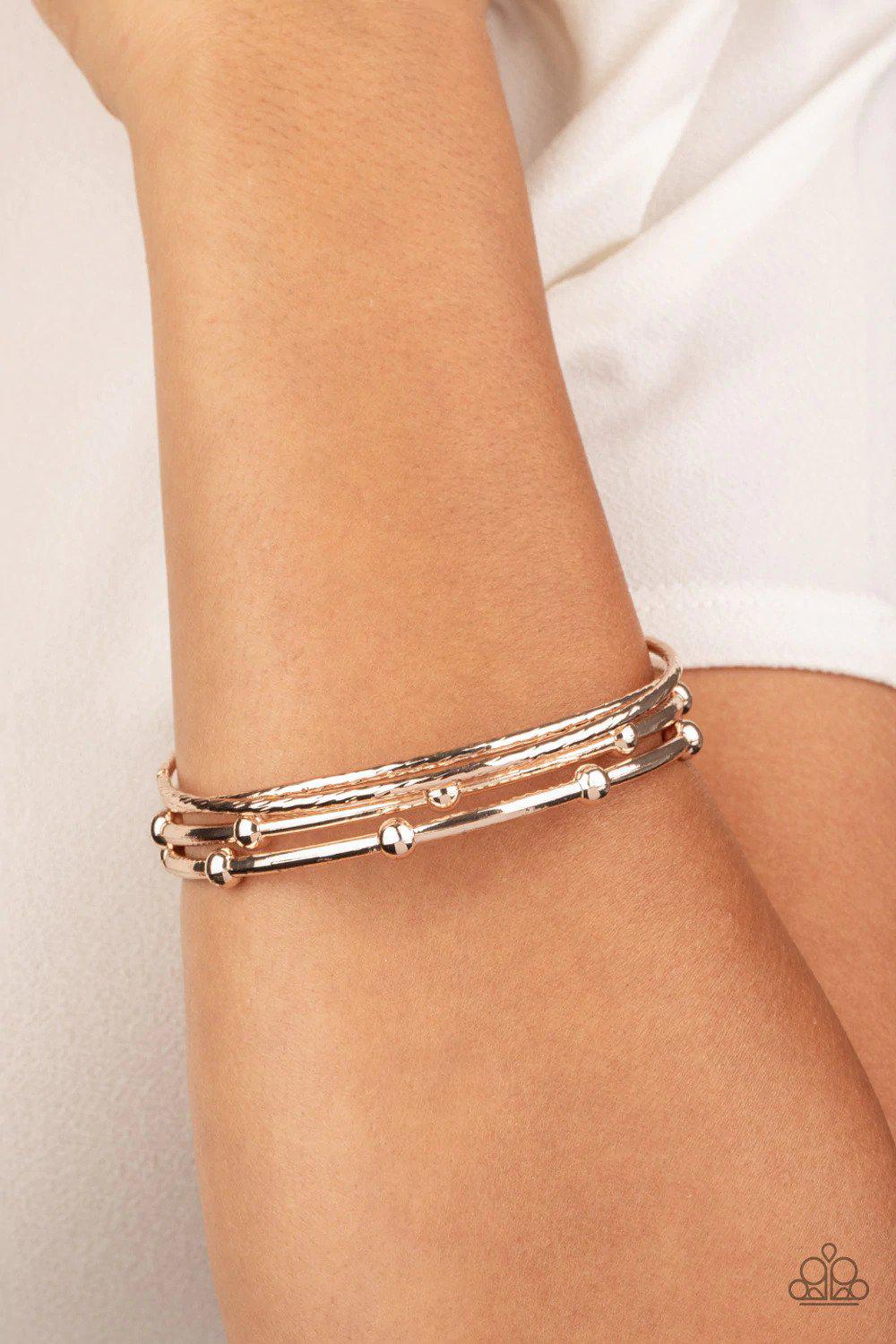 Beauty Basic Rose Gold Bangle Bracelet Set - Paparazzi Accessories- on model - CarasShop.com - Paparazzi Jewelry by Cara Jewels