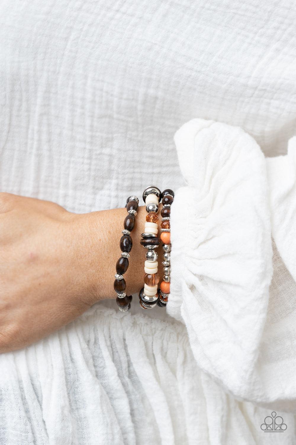Belongs In The Wild Multi Wood and Orange Stone Bracelet - Paparazzi Accessories- on model - CarasShop.com - Paparazzi Jewelry by Cara Jewels