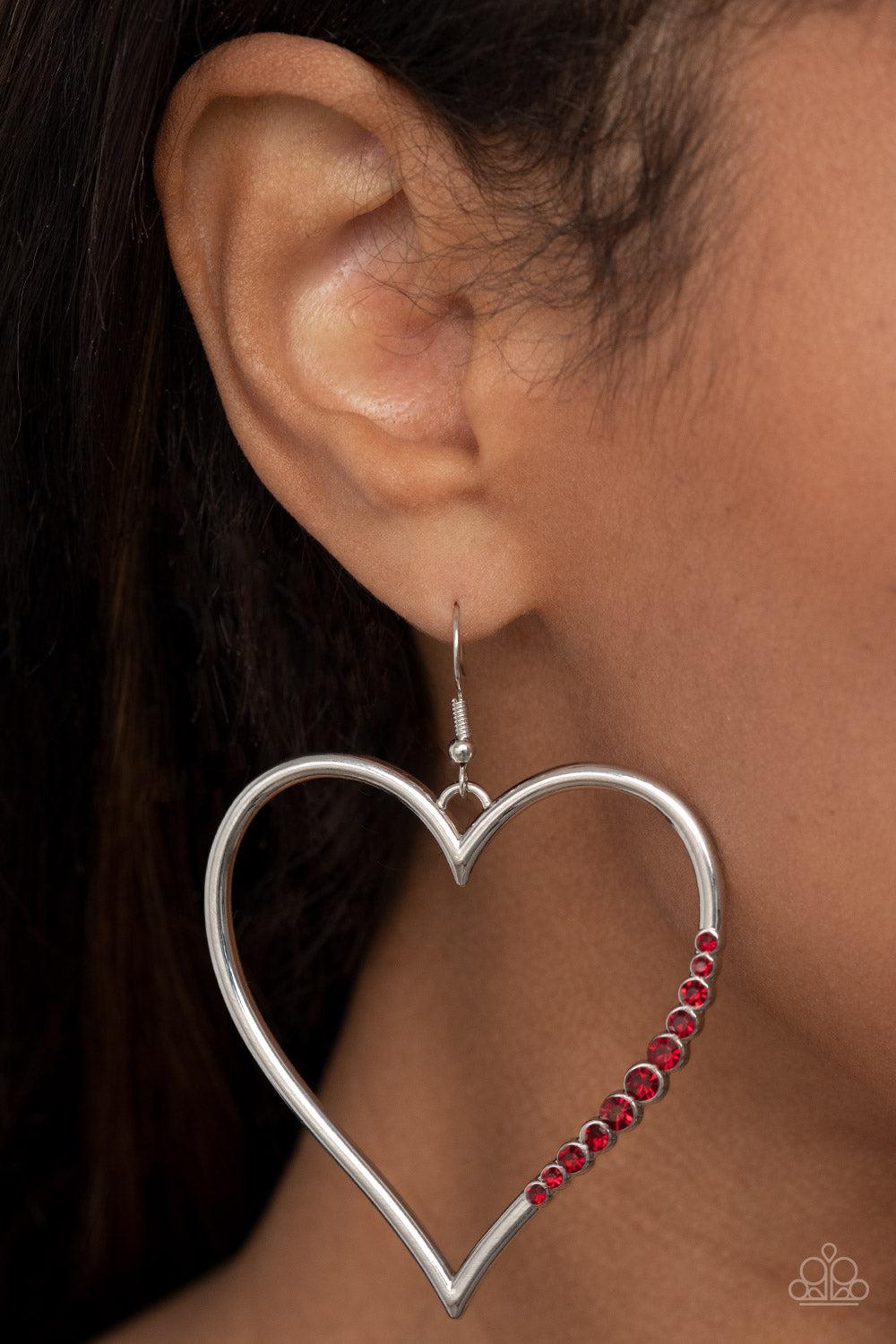 Bewitched Kiss Red Rhinestone Heart Earrings - Paparazzi Accessories- on model - CarasShop.com - Paparazzi Jewelry by Cara Jewels