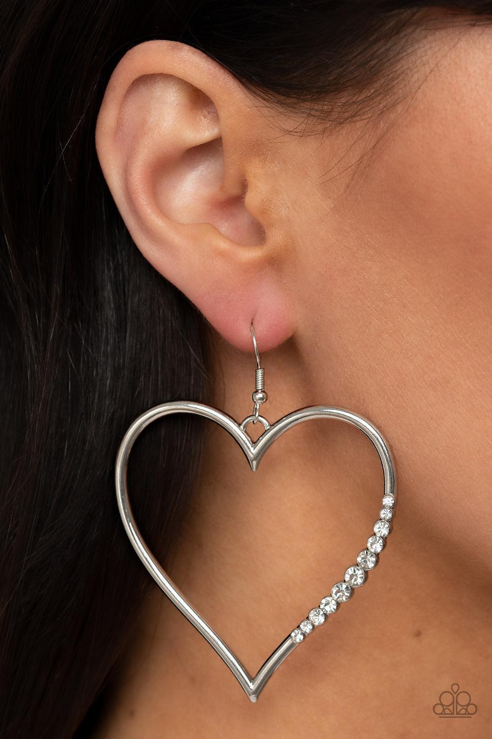Bewitched Kiss White Rhinestone Heart Earrings - Paparazzi Accessories- on model - CarasShop.com - Paparazzi Jewelry by Cara Jewels