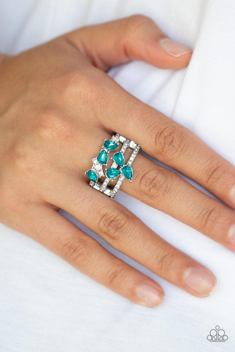 Blink Back TIERS Blue Rhinestone Ring - Paparazzi Accessories- on model - CarasShop.com - Paparazzi Jewelry by Cara Jewels