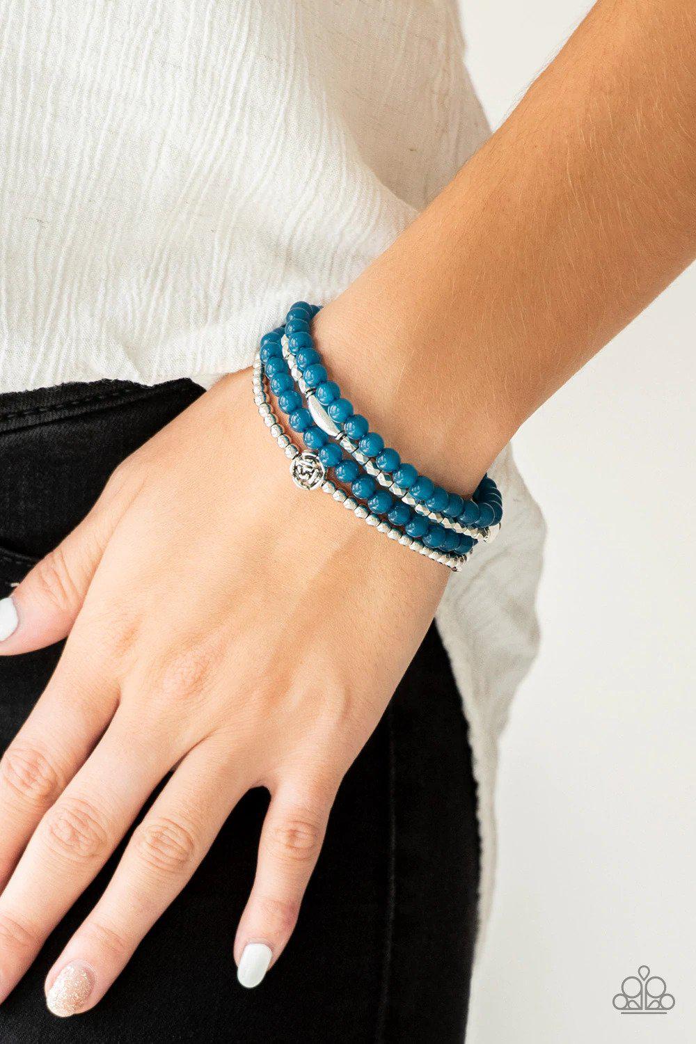 Blooming Buttercups Blue Bracelet - Paparazzi Accessories- on model - CarasShop.com - Paparazzi Jewelry by Cara Jewels