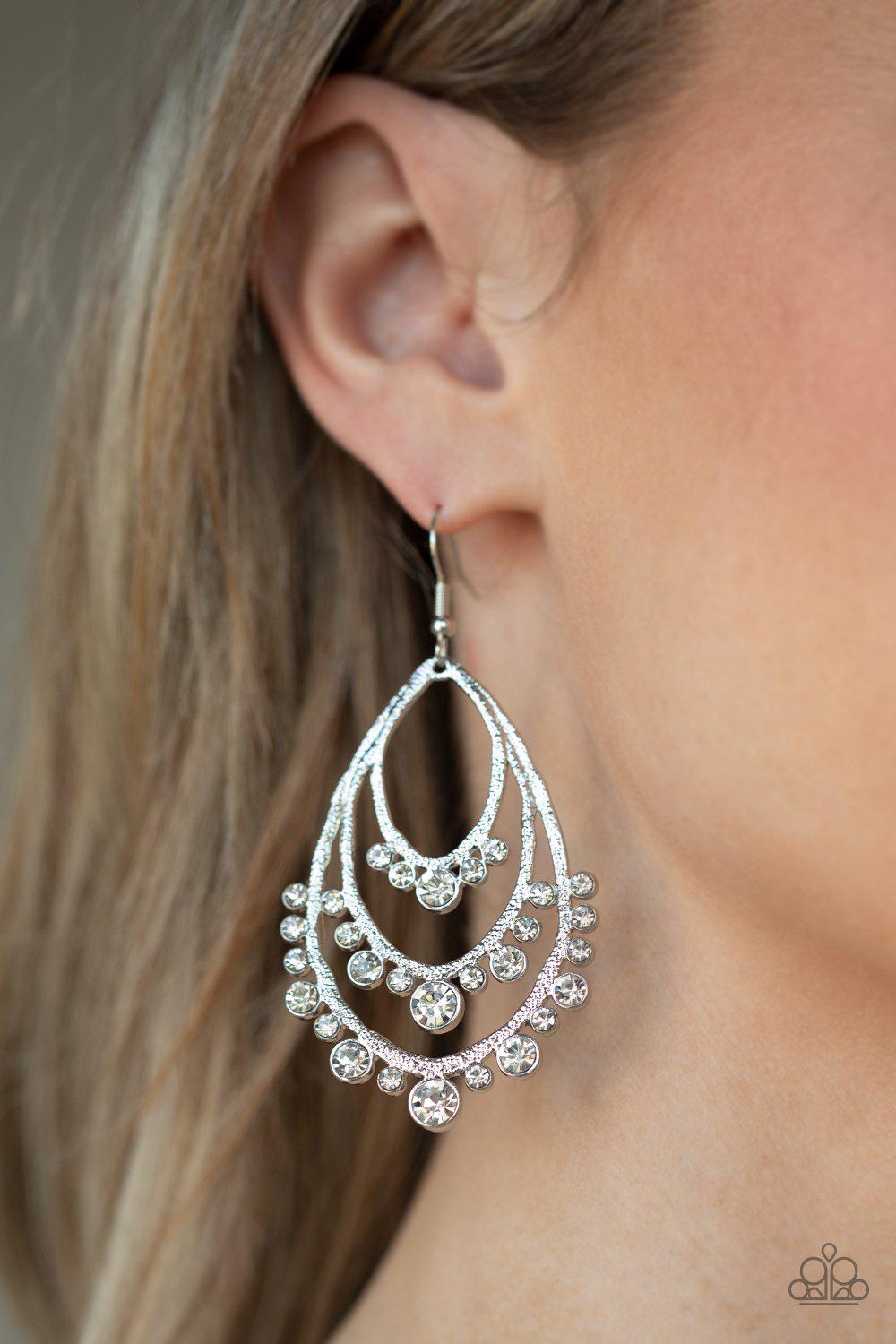 Break Out In TIERS White Rhinestone Teardrop Earrings - Paparazzi Accessories- on model - CarasShop.com - Paparazzi Jewelry by Cara Jewels